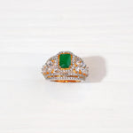 Gold-plated silver ring with a green rectangular stone and sparkling white accents