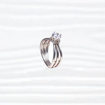92.5 pure silver ring with split triple band and single clear gemstone on white background