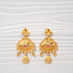 Pair of gold-plated dangle earrings with intricate design, pink and white stone accents