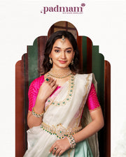 Woman in white saree with pink blouse, wearing 92.5 silver jewelry including choker necklace, bangles, earrings, and maang tikka.