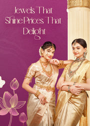 Two women in traditional sarees showcasing handcrafted silver jewelry, necklaces, and bangles