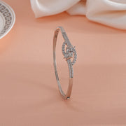 92.5 silver bracelet with cubic zirconia stones, floral leaf design on peach background