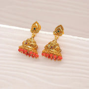 Traditional gold jhumka earrings with red beads and intricate detailing