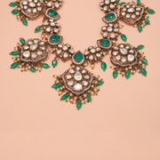 Silver Necklace with Kundans, Emeralds, and Floral Detailing