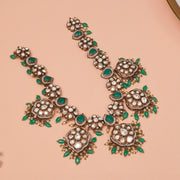 Silver Necklace with Kundans, Emeralds, and Floral Detailing