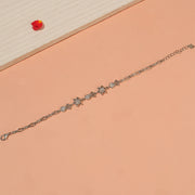 Sleek Silver Bracelet with Star and Stone Highlights