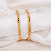 Elegant Gold Bangles with Ruby and Emerald Stone Accents