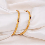 Elegant Gold Bangles with Ruby and Emerald Stone Accents