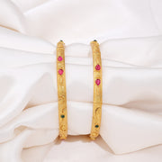 Elegant Gold Bangles with Ruby and Emerald Stone Accents