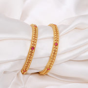 Traditional Textured Gold Bangles with Ruby Stone Accents