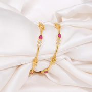 Elegant Ruby and CZ Gold Bangles with Leaf Motifs
