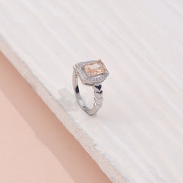 Elegant Silver Halo Ring with Peach Sapphire and CZ Accents