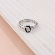 Modern Sterling Silver Oval Black Enamel Ring with Sparkling CZ's