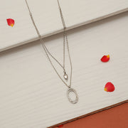 Sleek Two Layered Silver Chain with Oval and Leaf Pendants