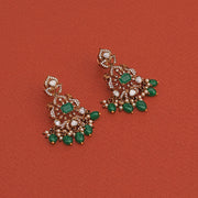 Floral Silver and Kundan Earrings with Peacock Detailing