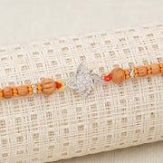 Floral Swastik Silver Rakhi